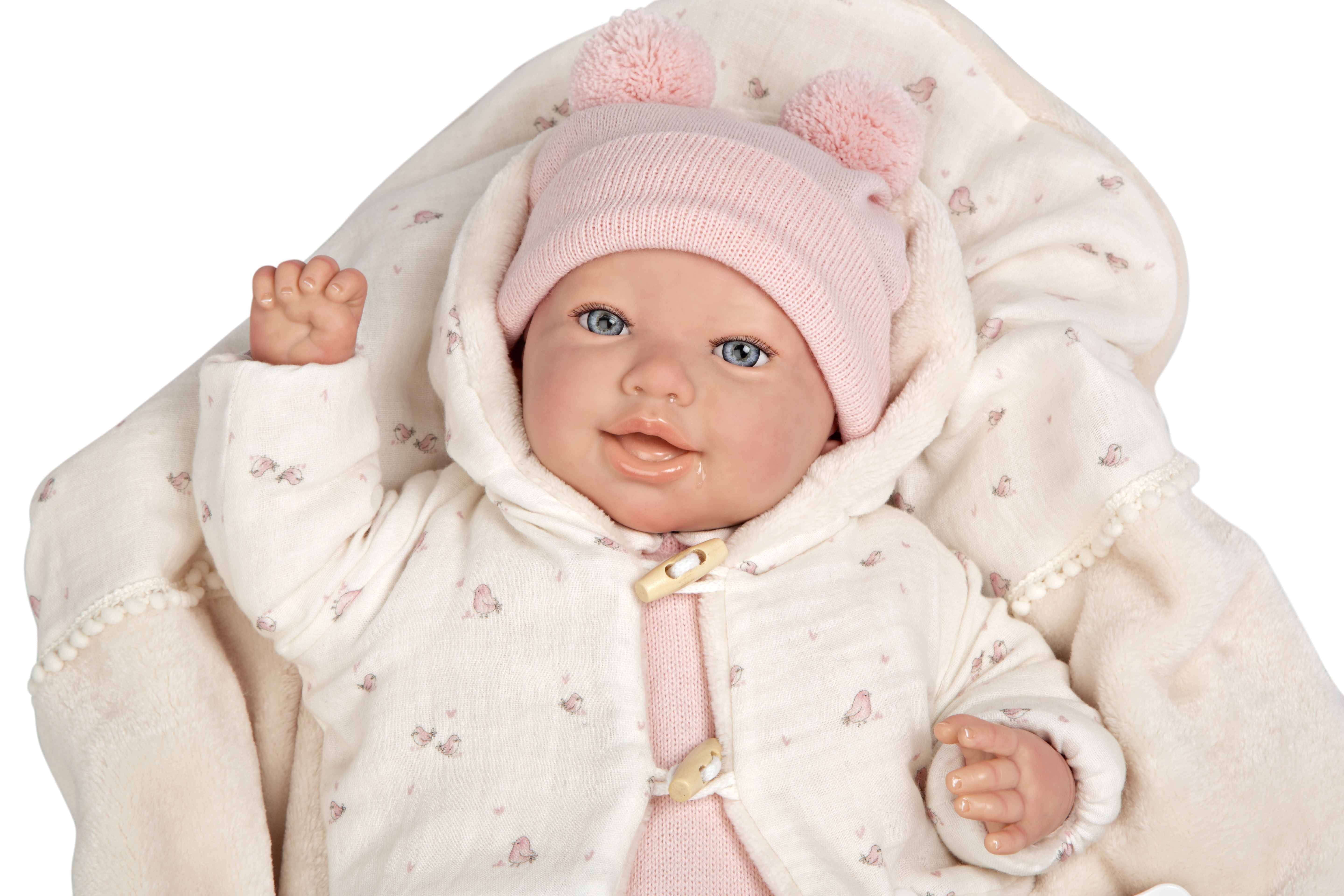 Primer plano detallado del rostro hiperrealista y la expresión dulce de la muñeca Reborn Elba de Arias.