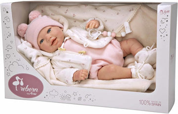 Bebé Reborn Elba de Arias de 45 centímetros con conjunto rosa de punto descansando en su cojín nido acolchado, un diseño cuidado donde cada juguete tiene un proposito.