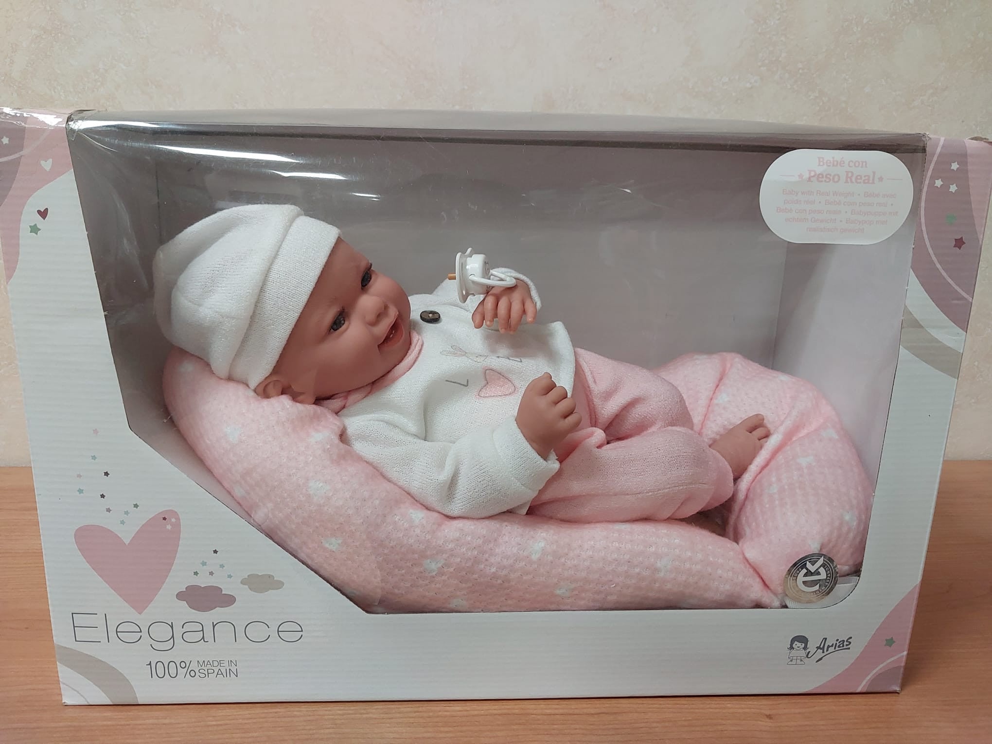 Muñeca con peso elegance 40 cm colin rosa con cojín - arias 60762