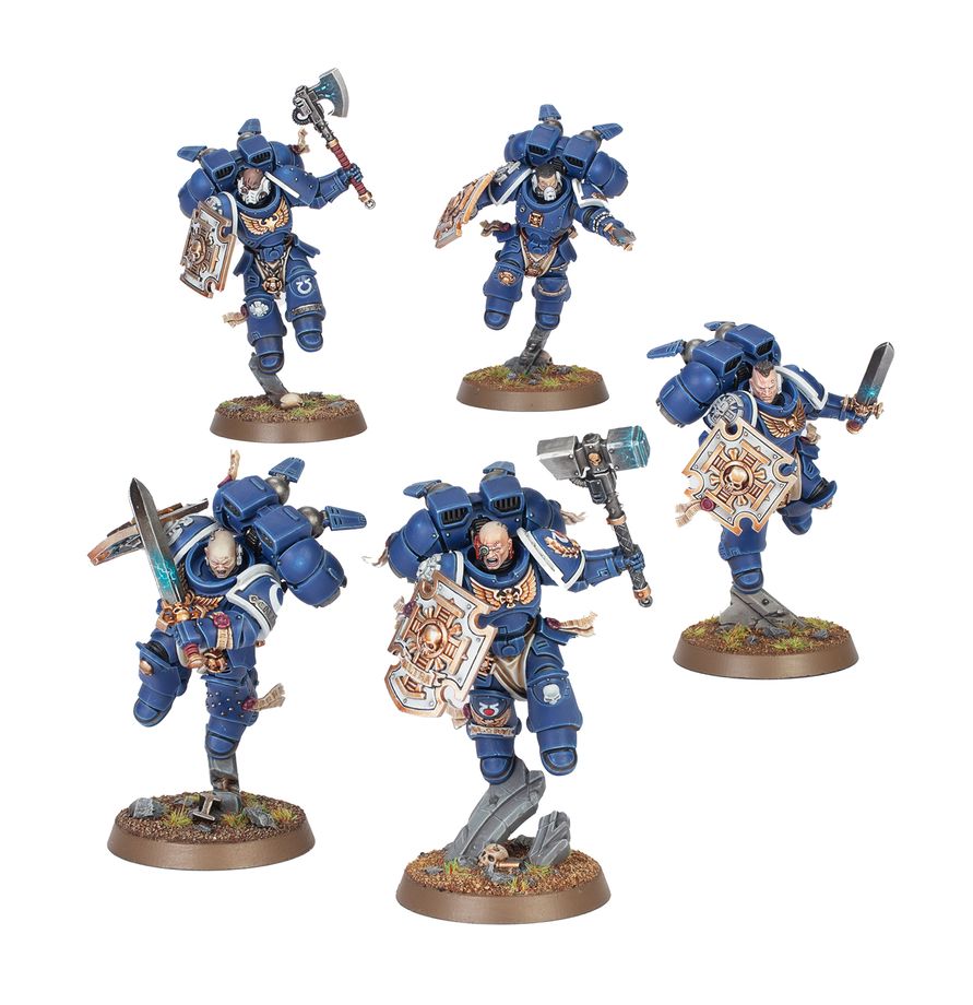 Escuadra de Veteranos de Vanguardia Warhammer 40.000, con distintas poses y detalles de armadura.