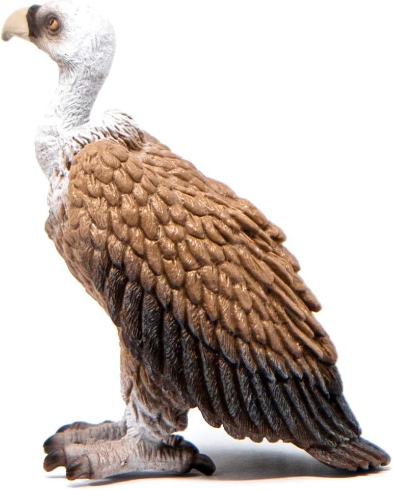 Figura de buitre Schleich integrada en un diorama de naturaleza salvaje con rocas y arena.