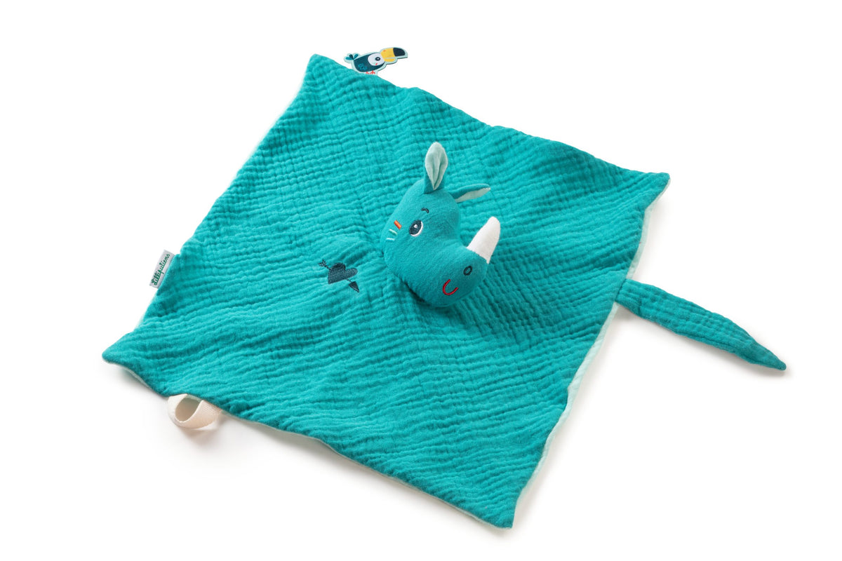 Doudou Marius de Lilliputiens extendido, con tejido turquesa, cabeza de rinoceronte y pequeñas etiquetas en los bordes