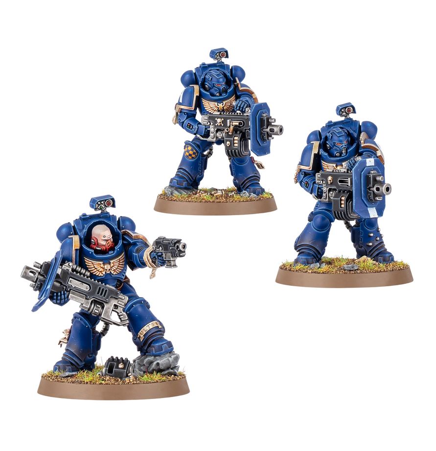 Tres Erradicadores con bólteres pesados Warhammer 40.000, pintados de azul y mostrados juntos sobre sus peanas.